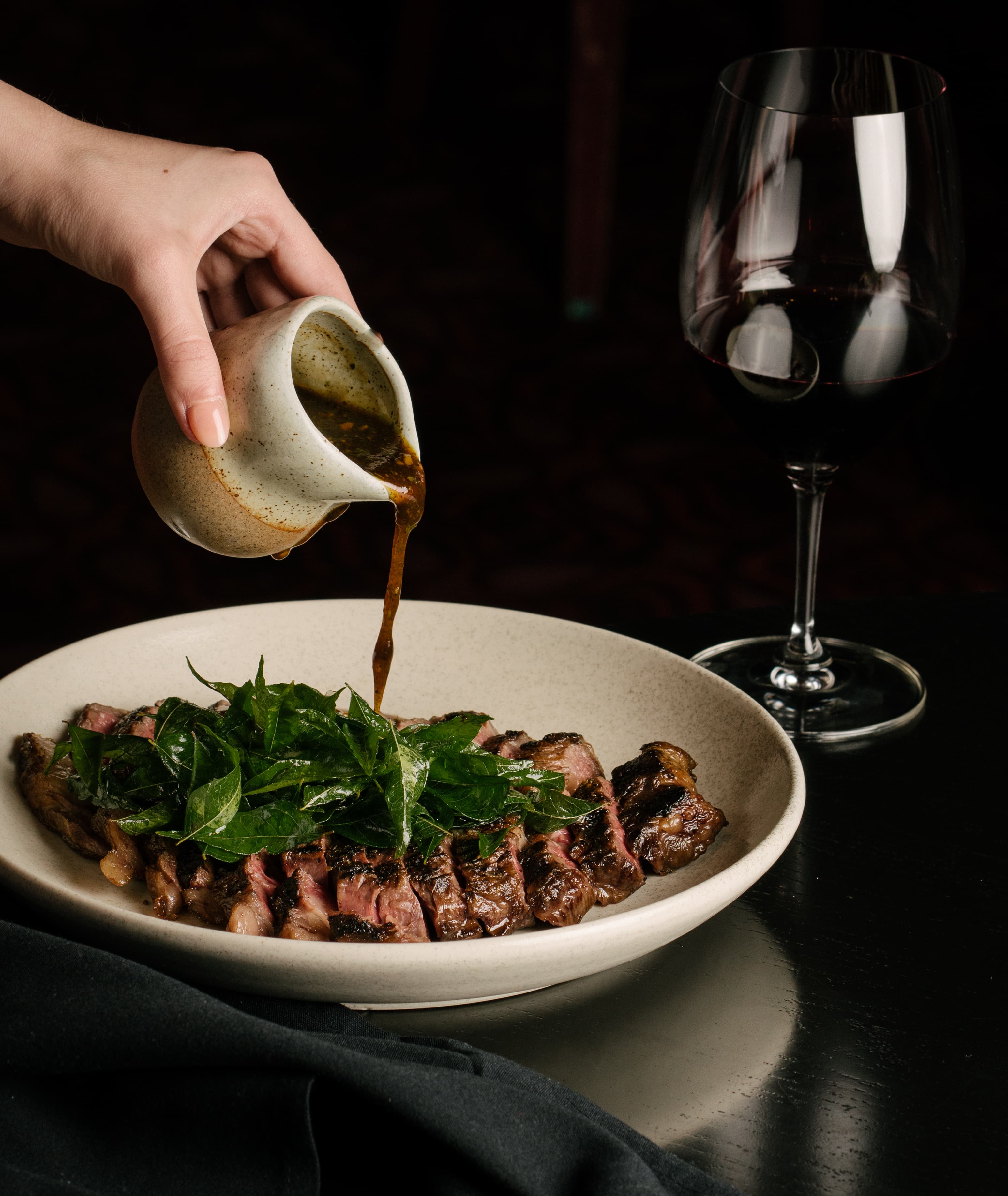 Dark moody steak photography for premium restaurant